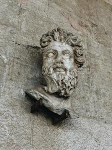 Sculpture of Head on Wall